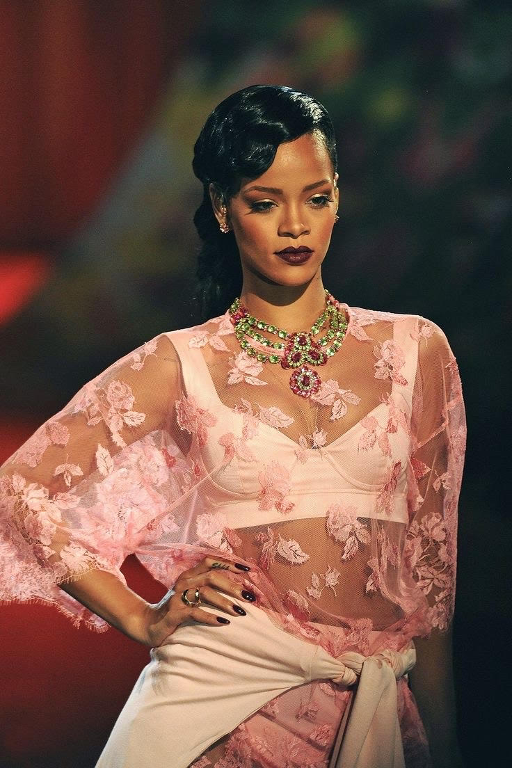 Rihanna performing and walking at the Victoria Secret Rurnway show