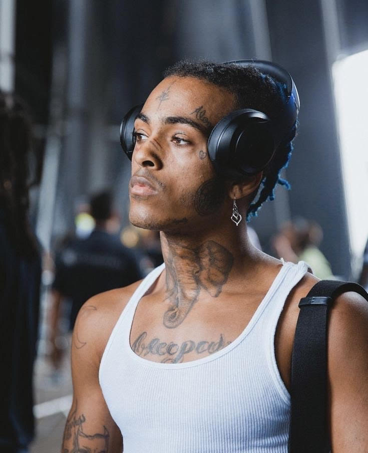 Image of XXXTENTACION with headphones on